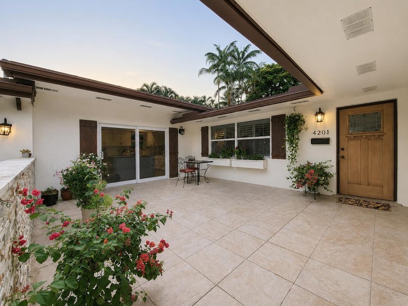 Welcome to this one-of-a-kind tropical retreat in the highly - photo 2