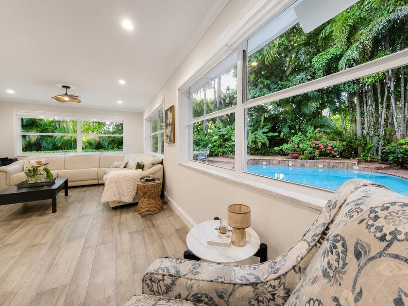 Welcome to this one-of-a-kind tropical retreat in the highly - photo 3
