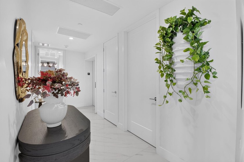 Discover Residence 601 - a rare corner residence in Royal Palm's - photo 6