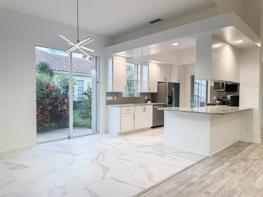Discover waterfront living at 7046 Fish Creek Lane, a stunning - photo 5