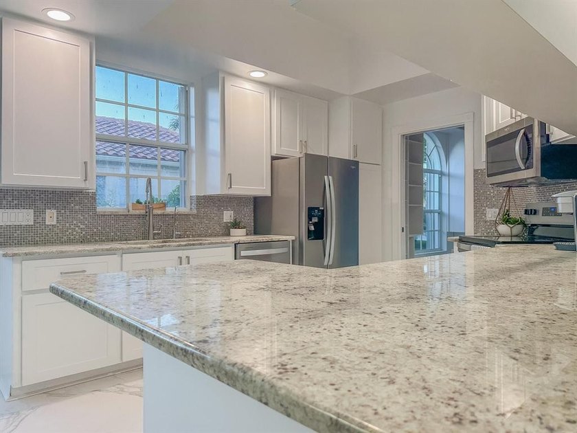 Discover waterfront living at 7046 Fish Creek Lane, a stunning - photo 7