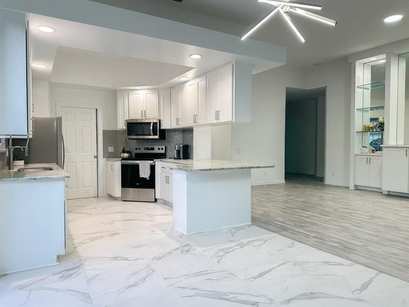 Discover waterfront living at 7046 Fish Creek Lane, a stunning - photo 8