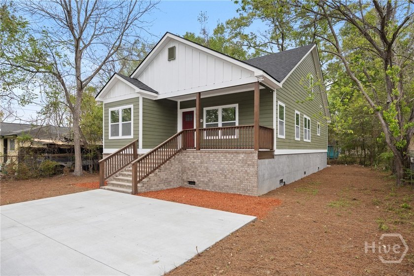 This stunning new construction 4BR/2BA custom crafted bungalow - photo 2