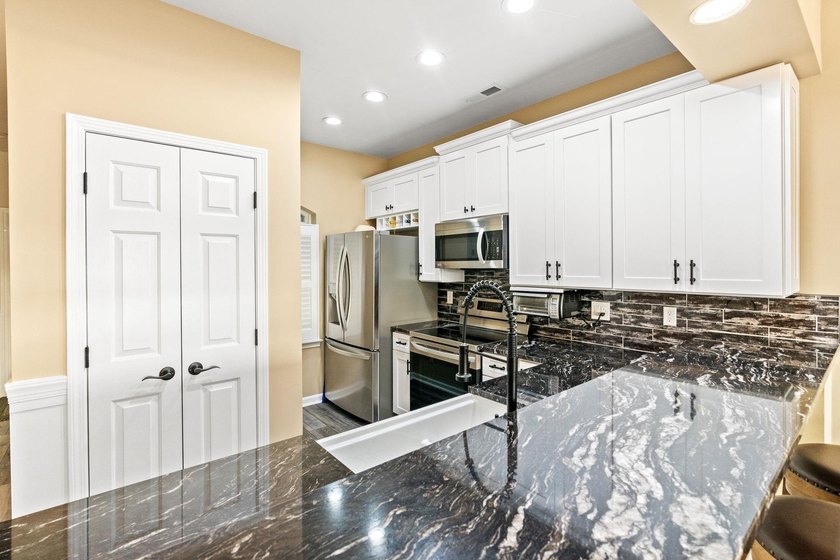 Fully Renovated Top-Floor Oasis with amazing ICW Views - - photo 16