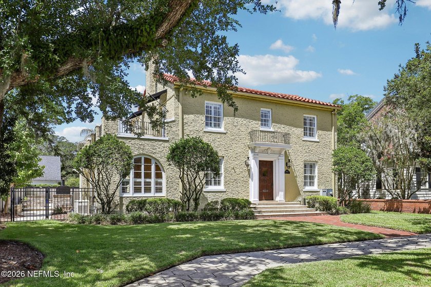 This exquisite block and stucco Mediterranean style home was - photo 3