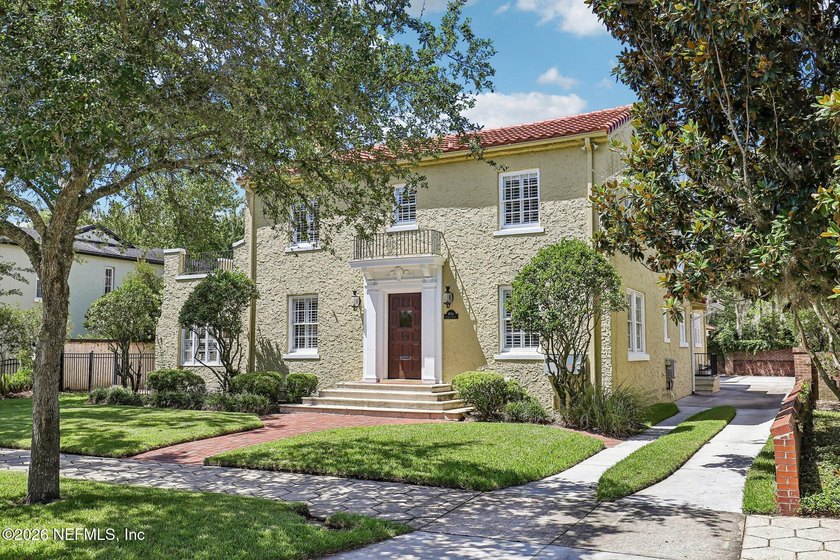 This exquisite block and stucco Mediterranean style home was - photo 4