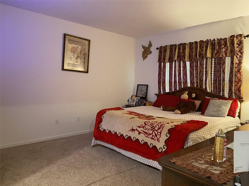 Step into this inviting 3-bedroom, 2-bath home located in the - photo 8