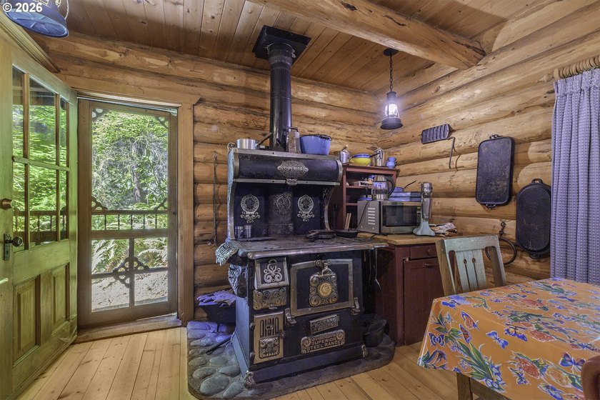 Experience a unique log cabin getaway at Fishhawk Lake, built - photo 11