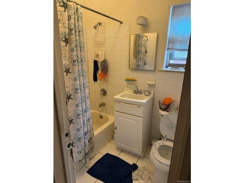 Semi-attached brick 2-family in desirable **Baychester**-a rare - photo 8