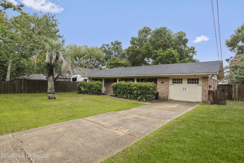 This charming home features a fenced backyard with a saltwater - photo 3