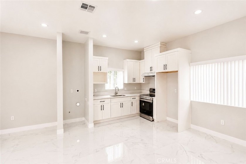 Beautifully updated property featuring a 4-bedroom, 2-bath main - photo 26