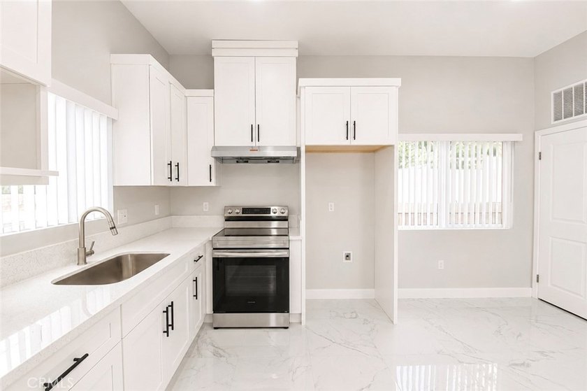 Beautifully updated property featuring a 4-bedroom, 2-bath main - photo 27
