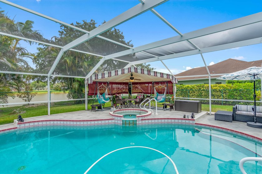 For sale for the first time, this custom built, lake front, pool - photo 45