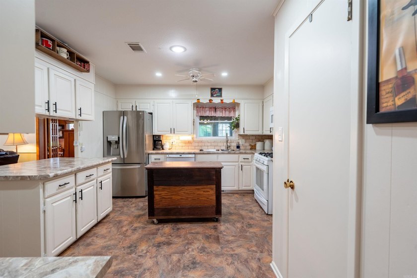 Endless Possibilities on 1.34 acres fully fenced. This - photo 12