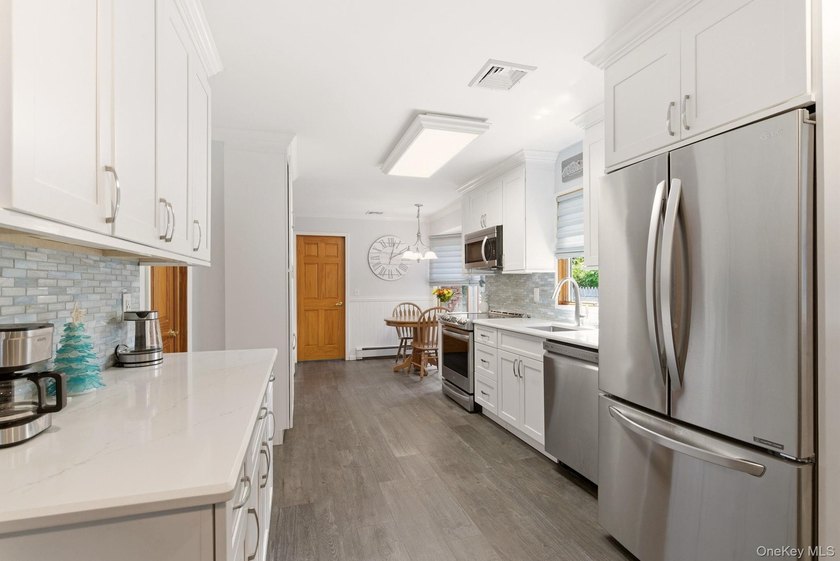 Welcome to this beautifully updated L-Shaped Ranch nestled in - photo 11