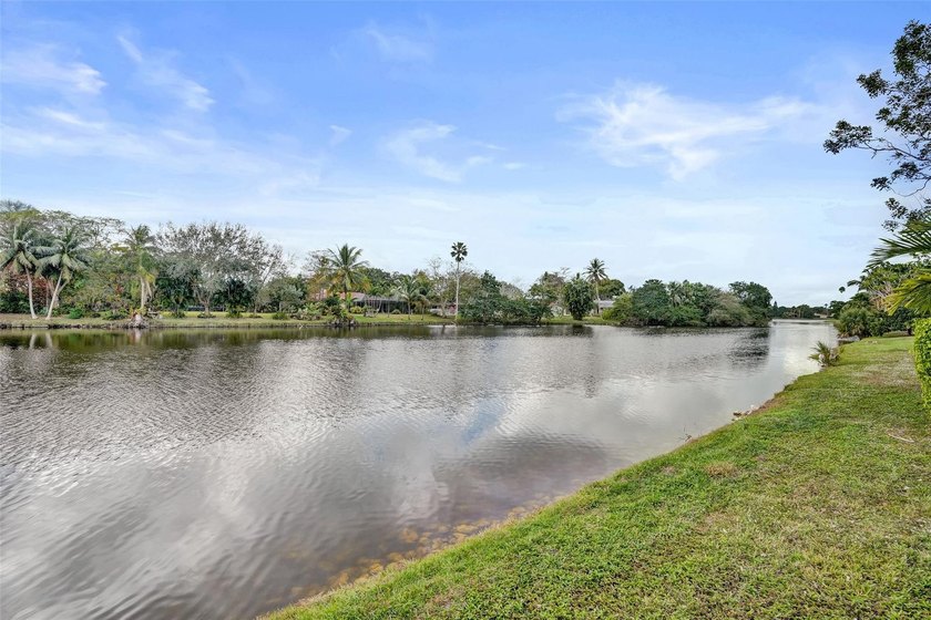 This beautifully updated 4BR/2.5BA waterfront home offers serene - photo 4