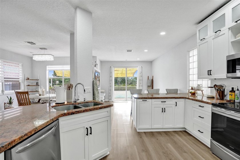 This beautifully updated 4BR/2.5BA waterfront home offers serene - photo 7