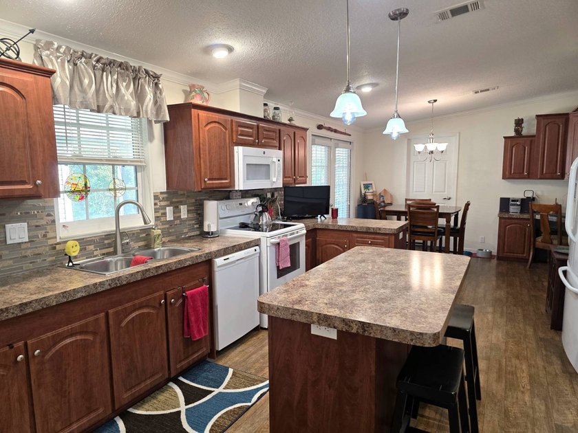 THIS HOME IS ON LEASED LAND WITH A MONTHLY LOT OF $545 AND THAT - photo 22