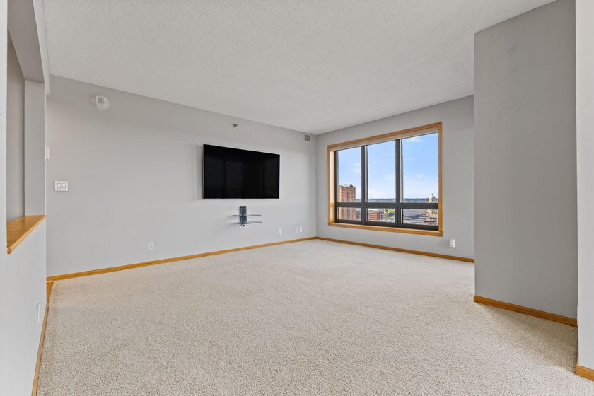 Set high on the 29th floor of Airye Tower, this corner-unit - photo 12