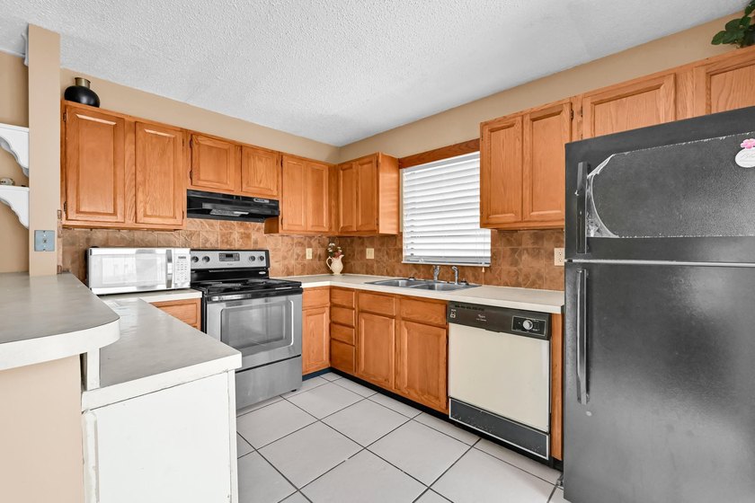 Welcome to this charming 2-bedroom, 1.5-bath townhouse featuring - photo 8