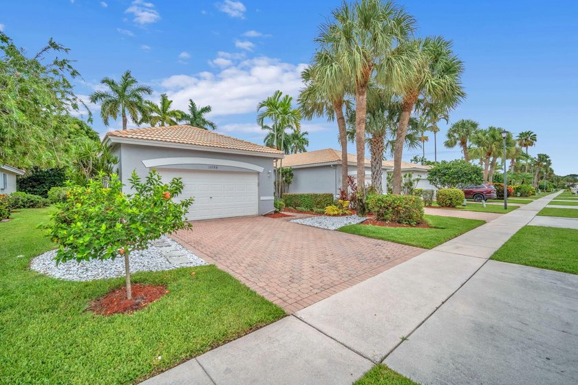 Welcome home to this beautifully updated villa in the highly - photo 2