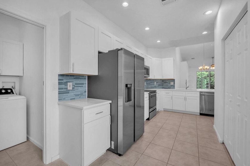 Welcome home to this beautifully updated villa in the highly - photo 6