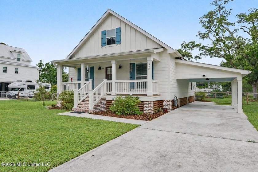 Nestled amongst majestic Live Oaks on one of Waveland's most - photo 2
