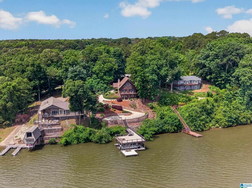 Experience refined lakefront living in this exceptional log - photo 2