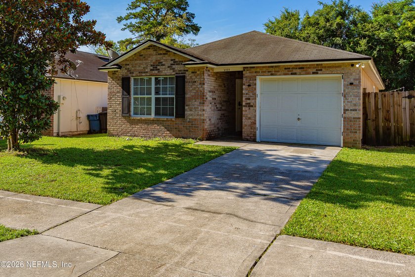 Welcome to this charming 4-bedroom, 2-bathroom home offering - photo 2