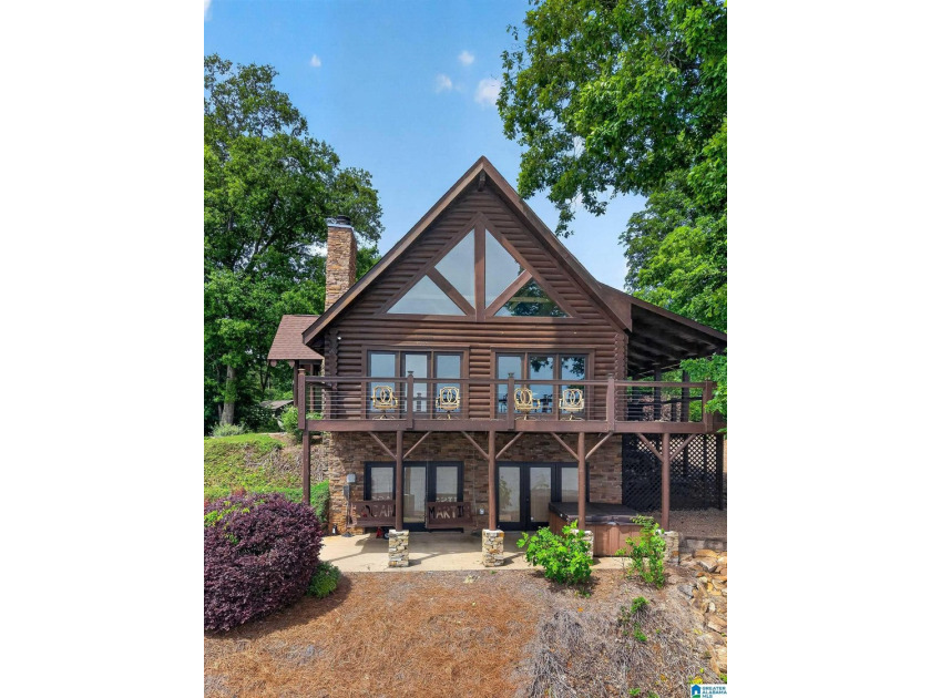 Experience refined lakefront living in this exceptional log - photo 6