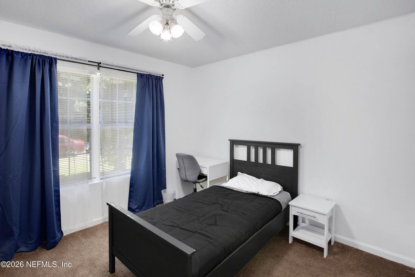 Welcome to this charming 4-bedroom, 2-bathroom home offering - photo 8