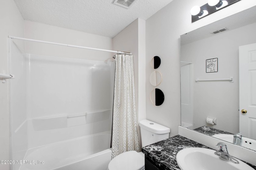 Welcome to this charming 4-bedroom, 2-bathroom home offering - photo 10