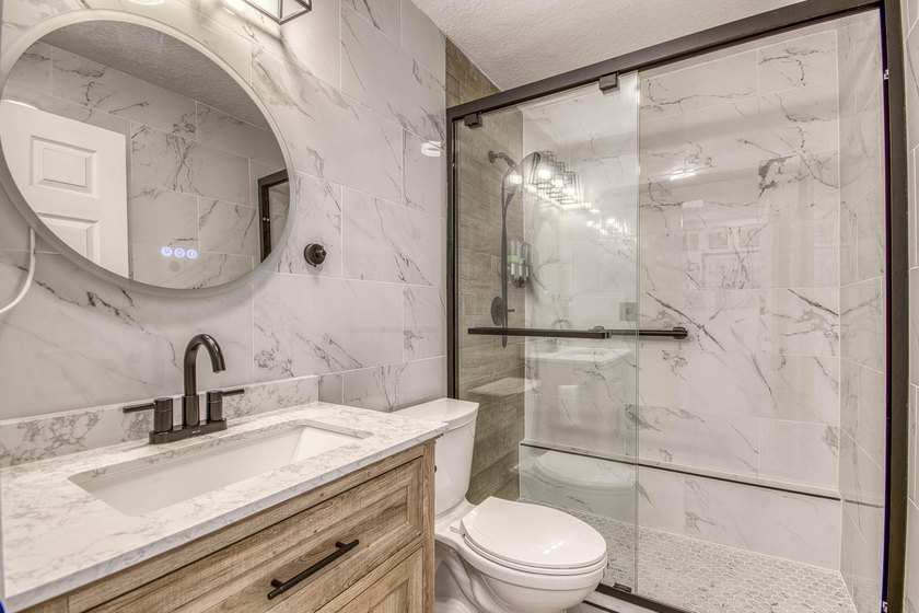 Beautifully updated 4-bedroom, 2-bath home featuring a brand-new - photo 19