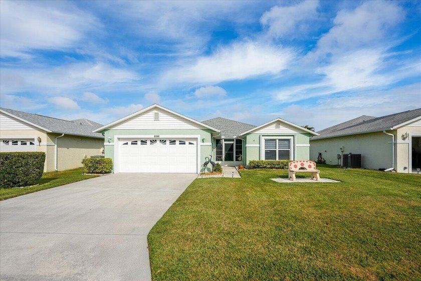 Welcome home to this impeccably kept home in a 55+ gated - photo 3
