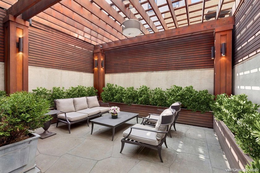 This exceptional over 20-foot-wide townhouse is discreetly - photo 13