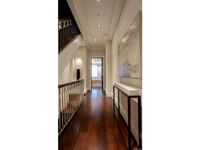 This exceptional over 20-foot-wide townhouse is discreetly - photo 27