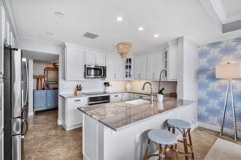 Escape to paradise in this exquisite updated penthouse unit at - photo 14