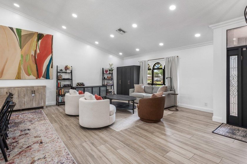 Stunning, fully renovated 4 BD, 2.5 BA residence situated on an - photo 4