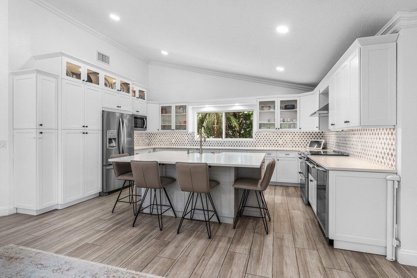 Stunning, fully renovated 4 BD, 2.5 BA residence situated on an - photo 8