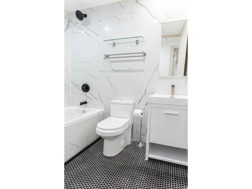 This lovely 2-family home was gut renovated in 2020 and includes - photo 3