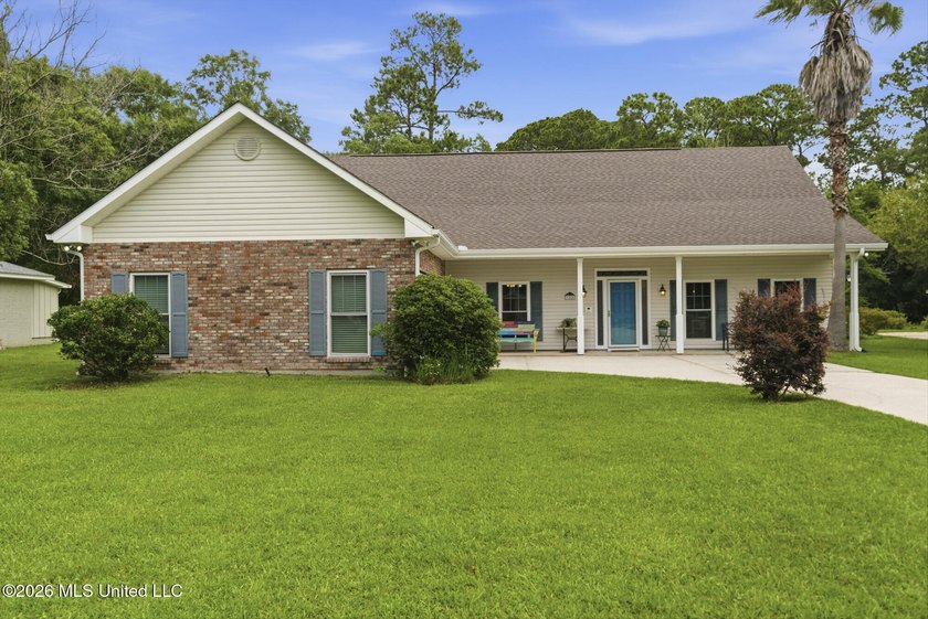 Welcome home to this charming 3-bedroom, 2-bath residence in the - photo 2