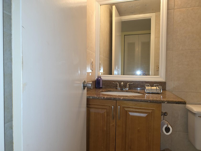 Well-maintained 1-bedroom, 1.5-bath residence featuring granite - photo 17