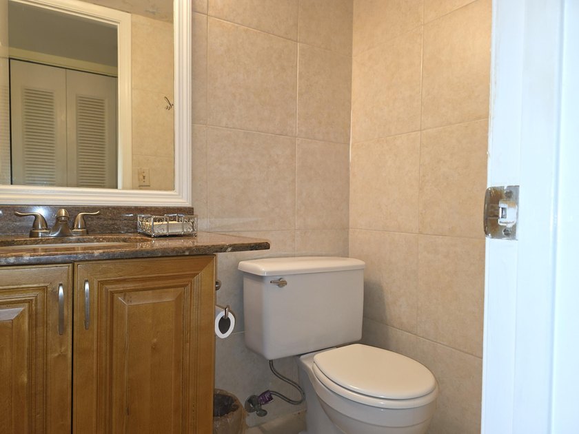 Well-maintained 1-bedroom, 1.5-bath residence featuring granite - photo 19