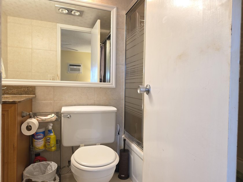 Well-maintained 1-bedroom, 1.5-bath residence featuring granite - photo 23