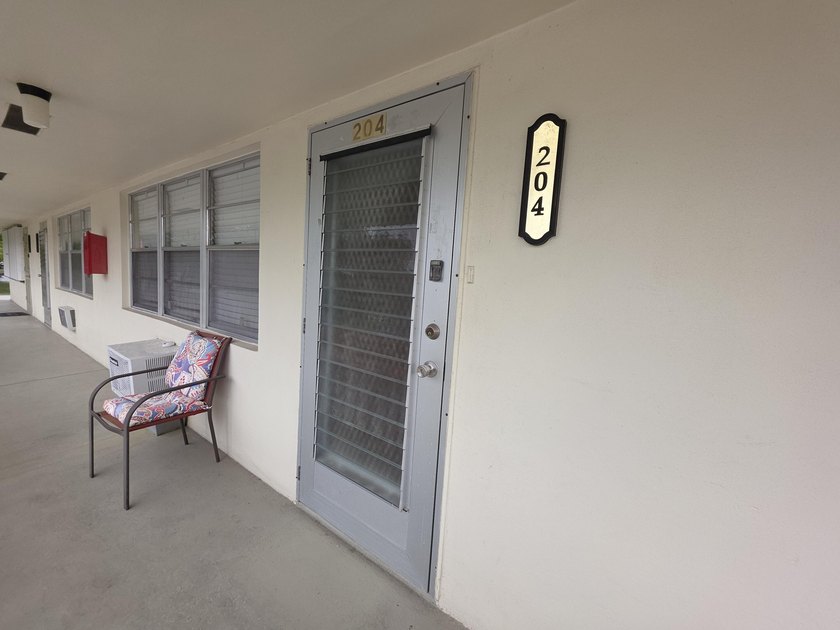 Well-maintained 1-bedroom, 1.5-bath residence featuring granite - photo 32