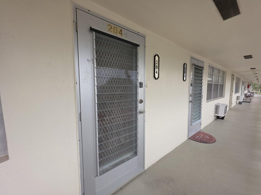 Well-maintained 1-bedroom, 1.5-bath residence featuring granite - photo 34