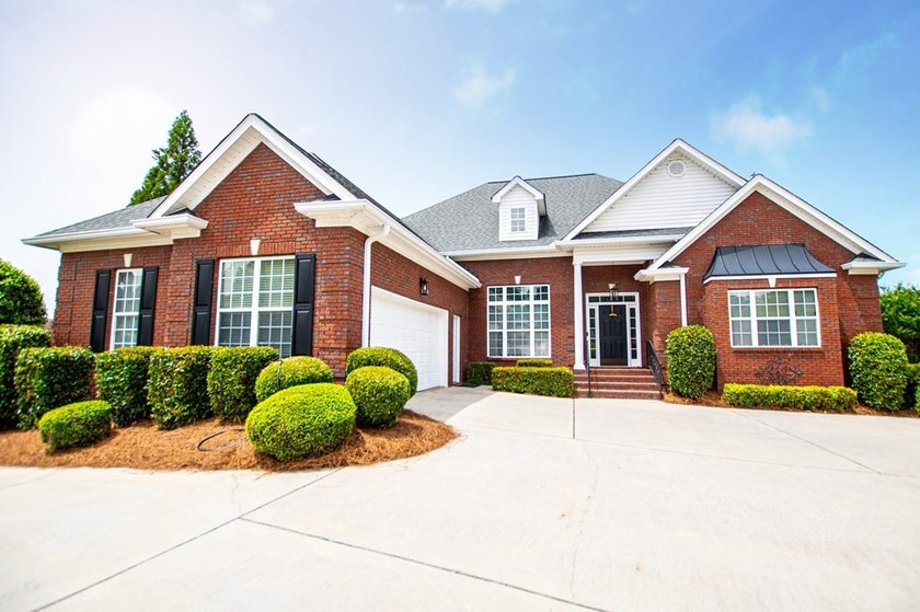 Coming soon! Lakeside Luxury! This stunning 4-sided brick ranch - photo 3