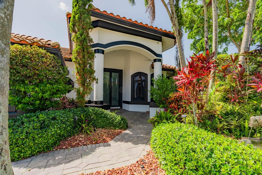 Welcome to this fully renovated lakefront home tucked away on a - photo 2