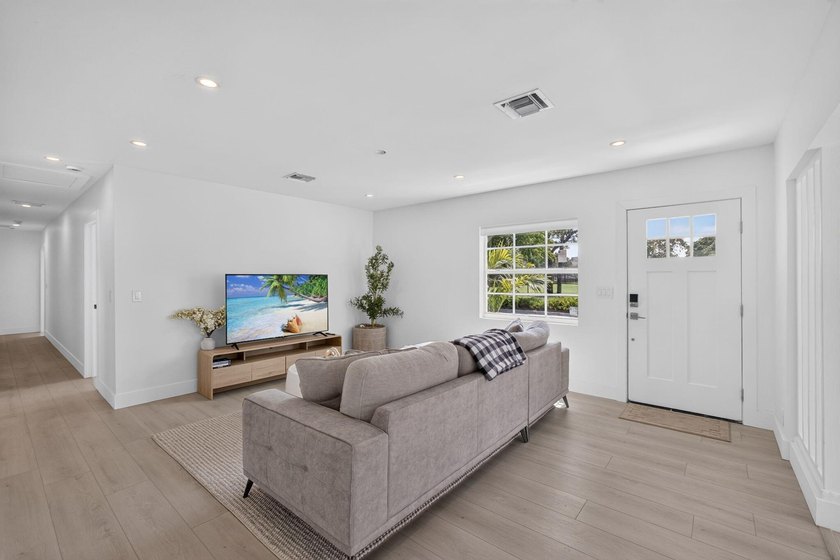 Completely rebuilt 4BR/3BA home featuring a major renovation - photo 4