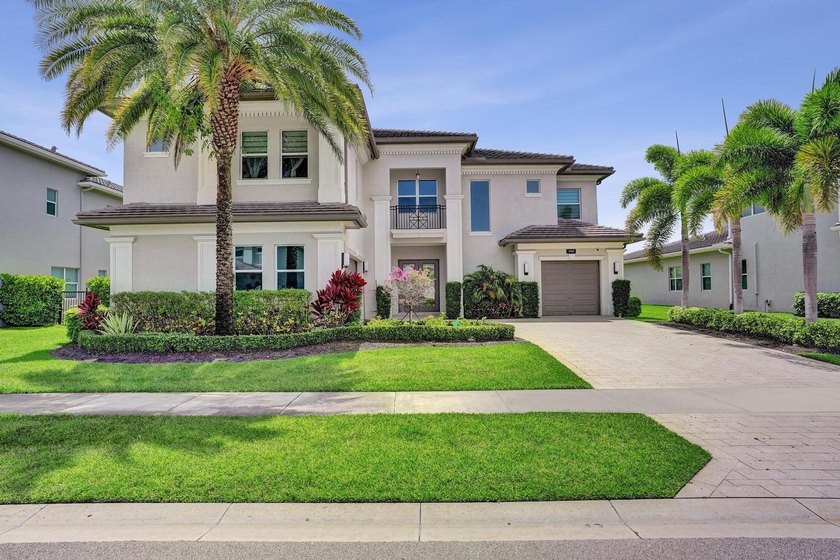 Discover elevated Florida living in this exceptional 5-bedroom - photo 2